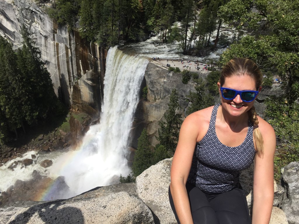 a woman sitting next to Vernal Falls on the Mist Trail