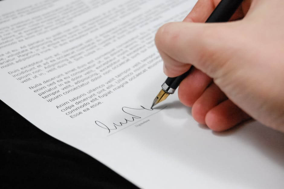 a person signing a document