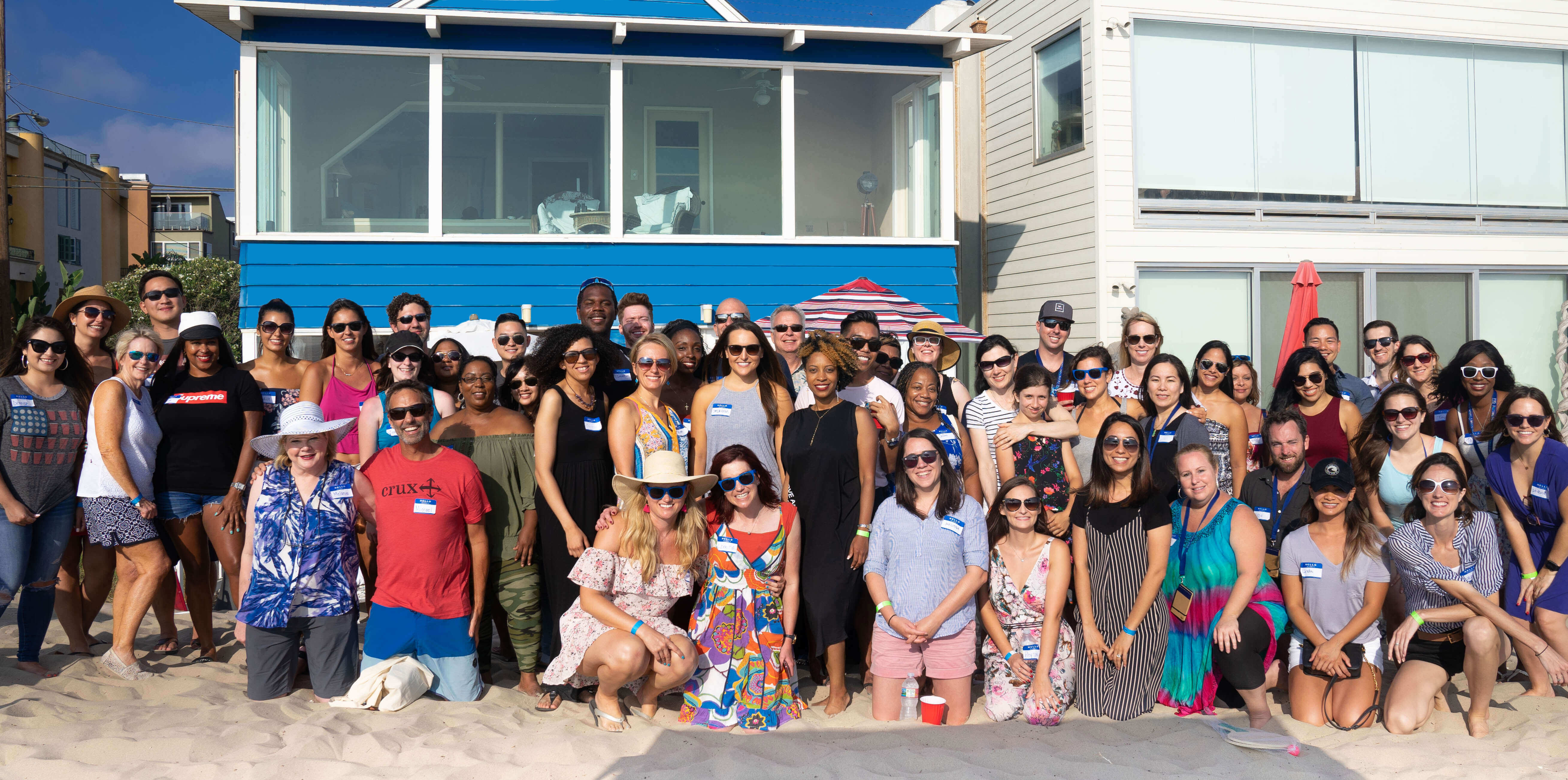 group of traveling therapists in front of a beach house