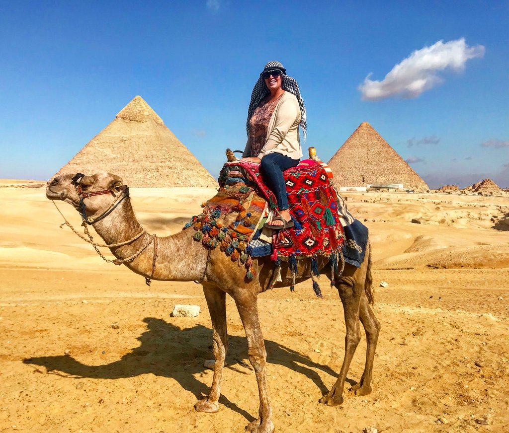 women riding a camel