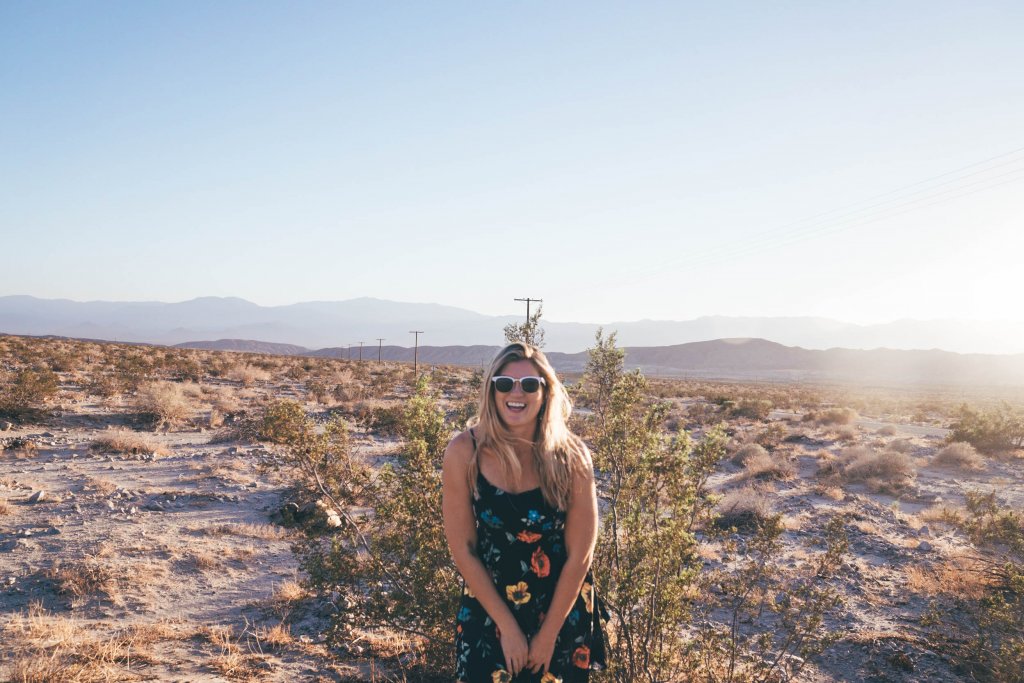 a women smiling in the desert