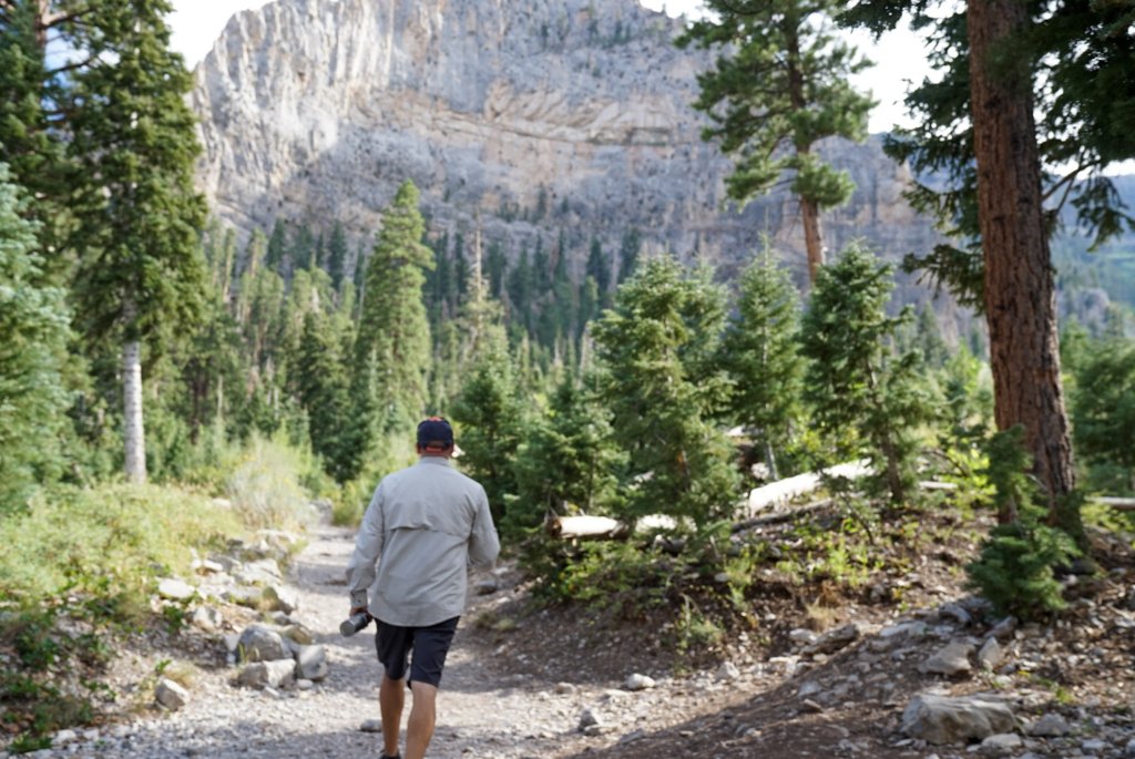 a man walking on a trail