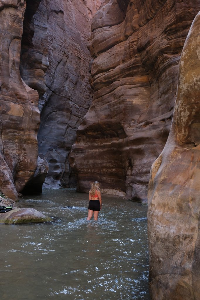 a women standing in a Wadi Majib slot canyon in Jordan