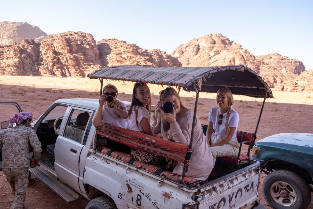 women riding in a truck