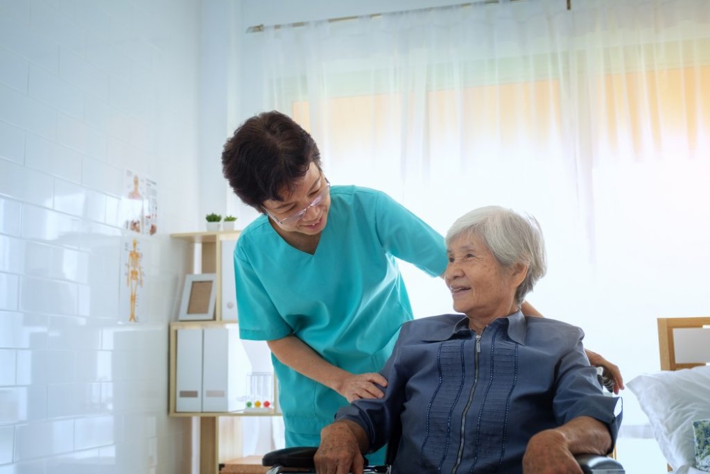 a caregiver and women in an SNF