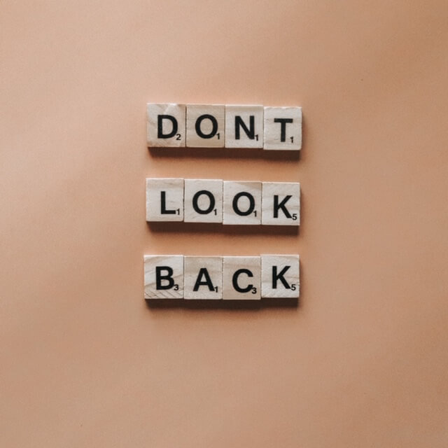 block words saying "don't look back"