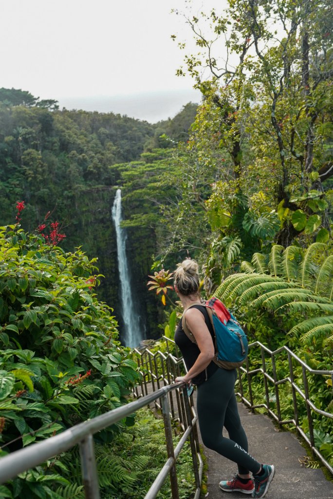 a women looking at Akaka waterfalls in Hawaii