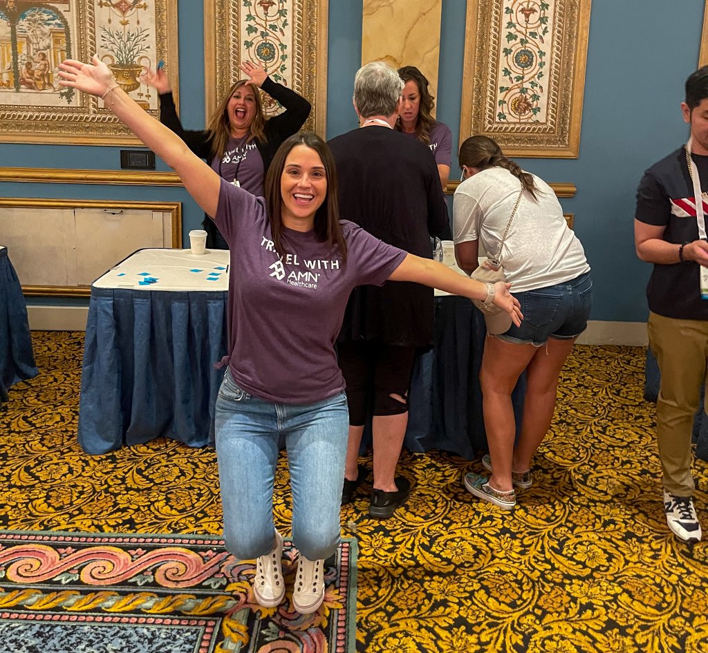 a woman opening her arms wide
