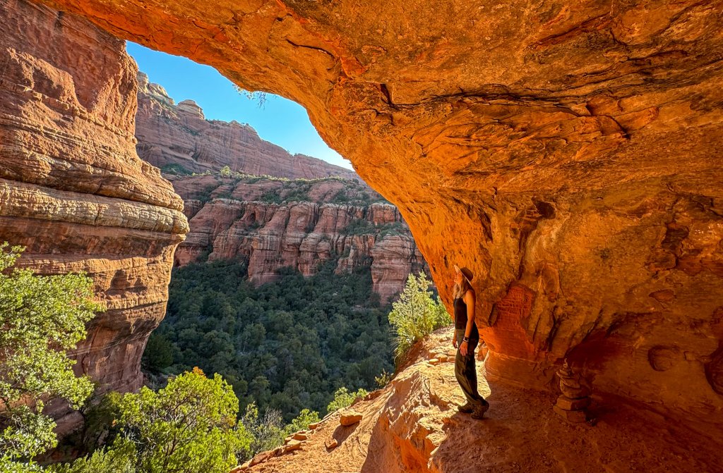 a woman standing in a cave in sedona, AZ