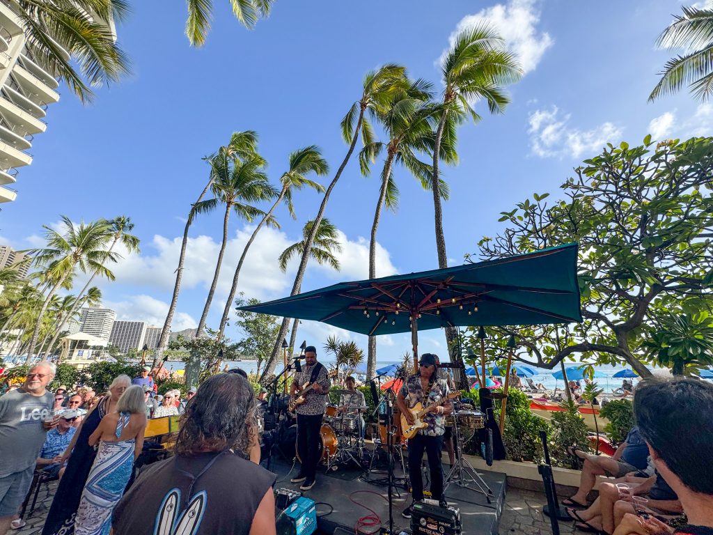 a band singing on the beach
