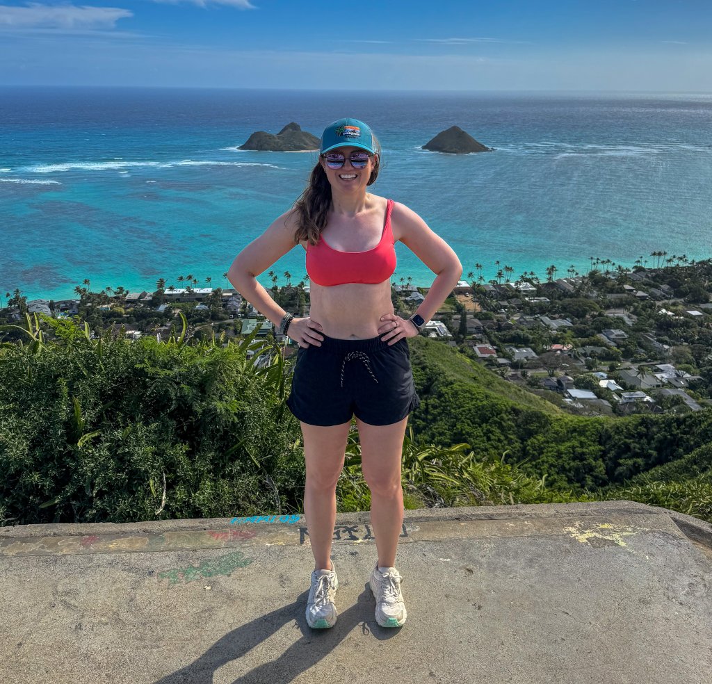 a woman in front of the beach on a pillbox