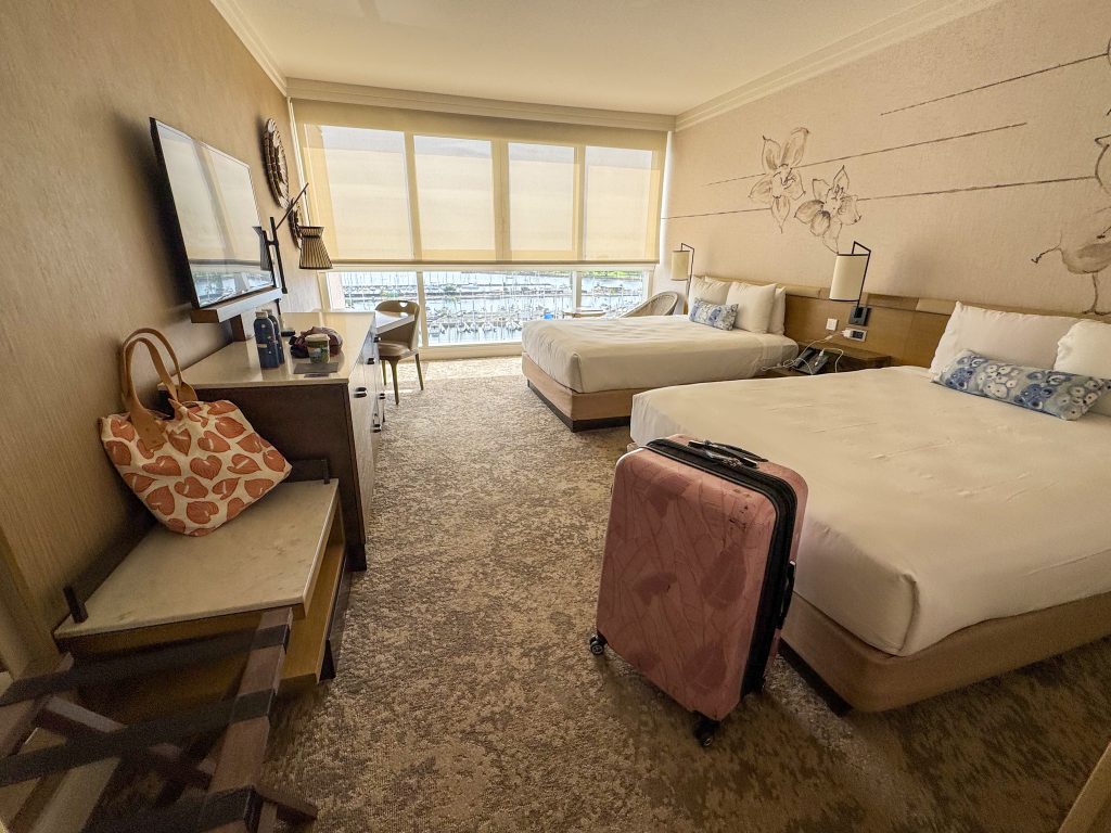 a hotel room with 2 beds