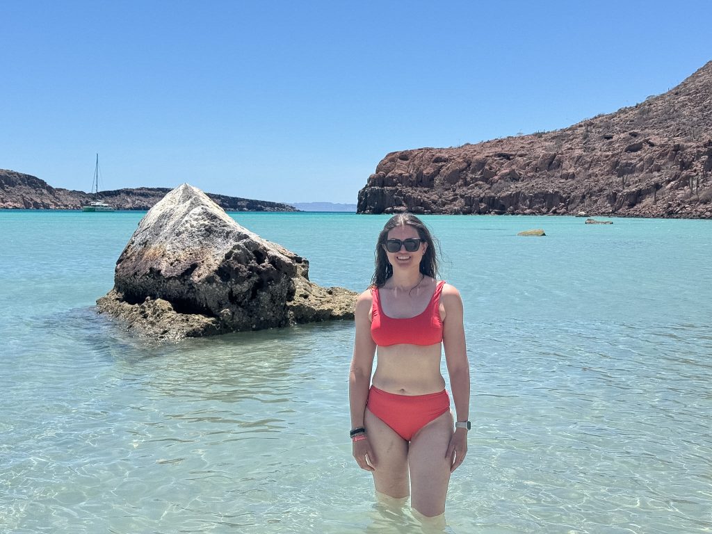 a woman standing in the ocean