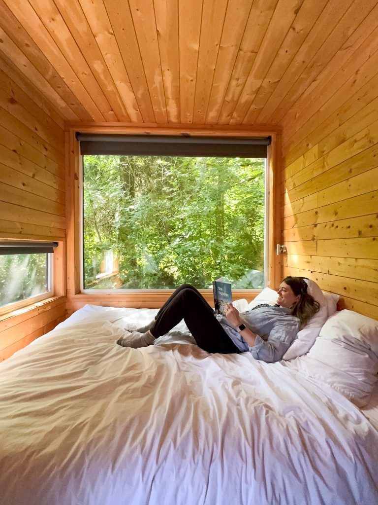a woman reading in a bed